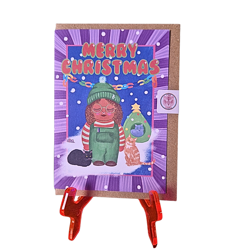 Christmas card with a colorful illustration of a person and dog, featuring 'Merry Christmas' text on a purple background.